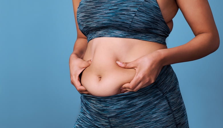 Cropped shot of an unrecognizable woman struggling with weight issues